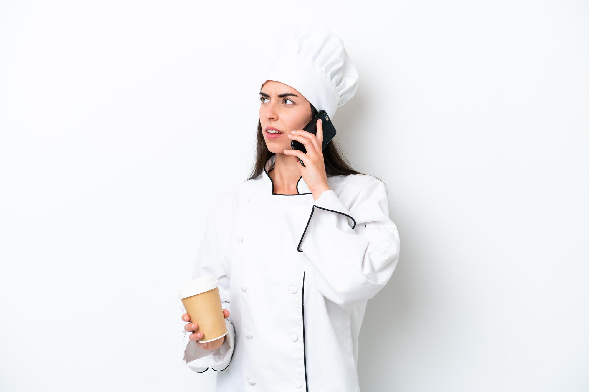 Team member answering email in kitchen